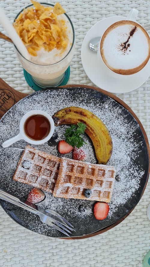 Free Waffles on a Black Plate Stock Photo