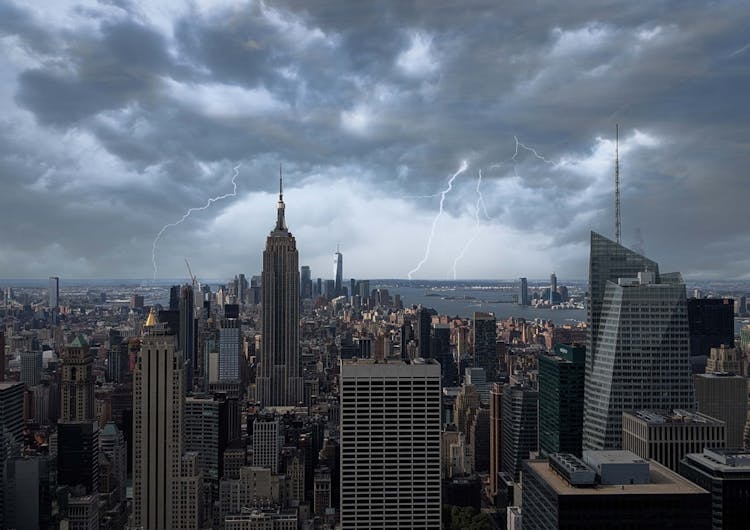 City Buildings Under Stormy Sky