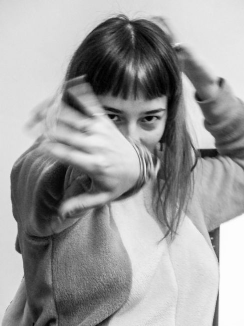 Captivating monochrome portrait capturing the motion and energy of a woman.