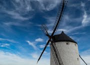 Black and White Windmill Tower and Clear Blue Sky