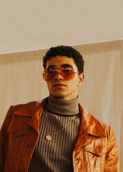 Man in Brown Leather Jacket Wearing Sunglasses