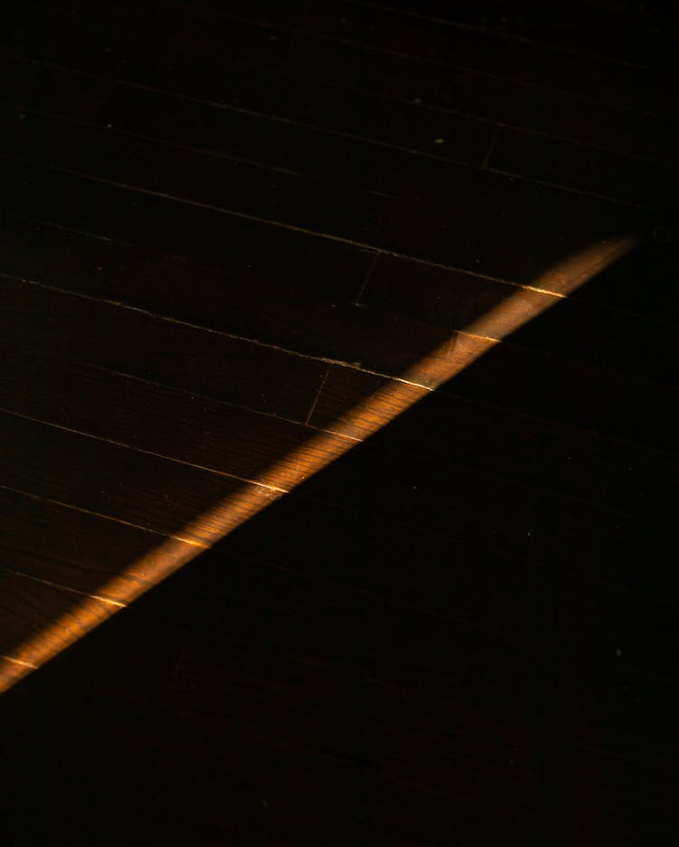 Brick Wall With Thin Line Of Light In Darkness