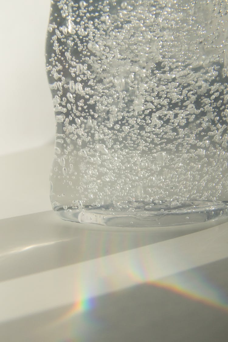 Transparent Glass Vase With Fizzy Water In Sunlight