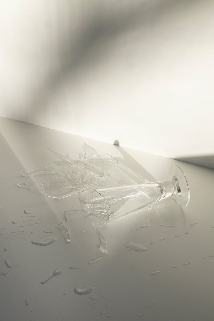 Broken Water Glass Scattered On White Table