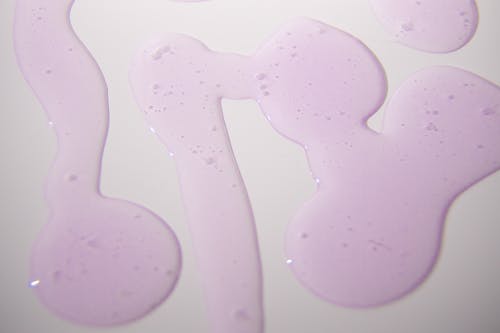 Abstract background of gel spilled on white surface
