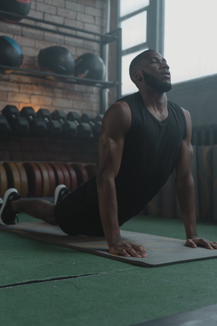 A Man Working Out In The Gym