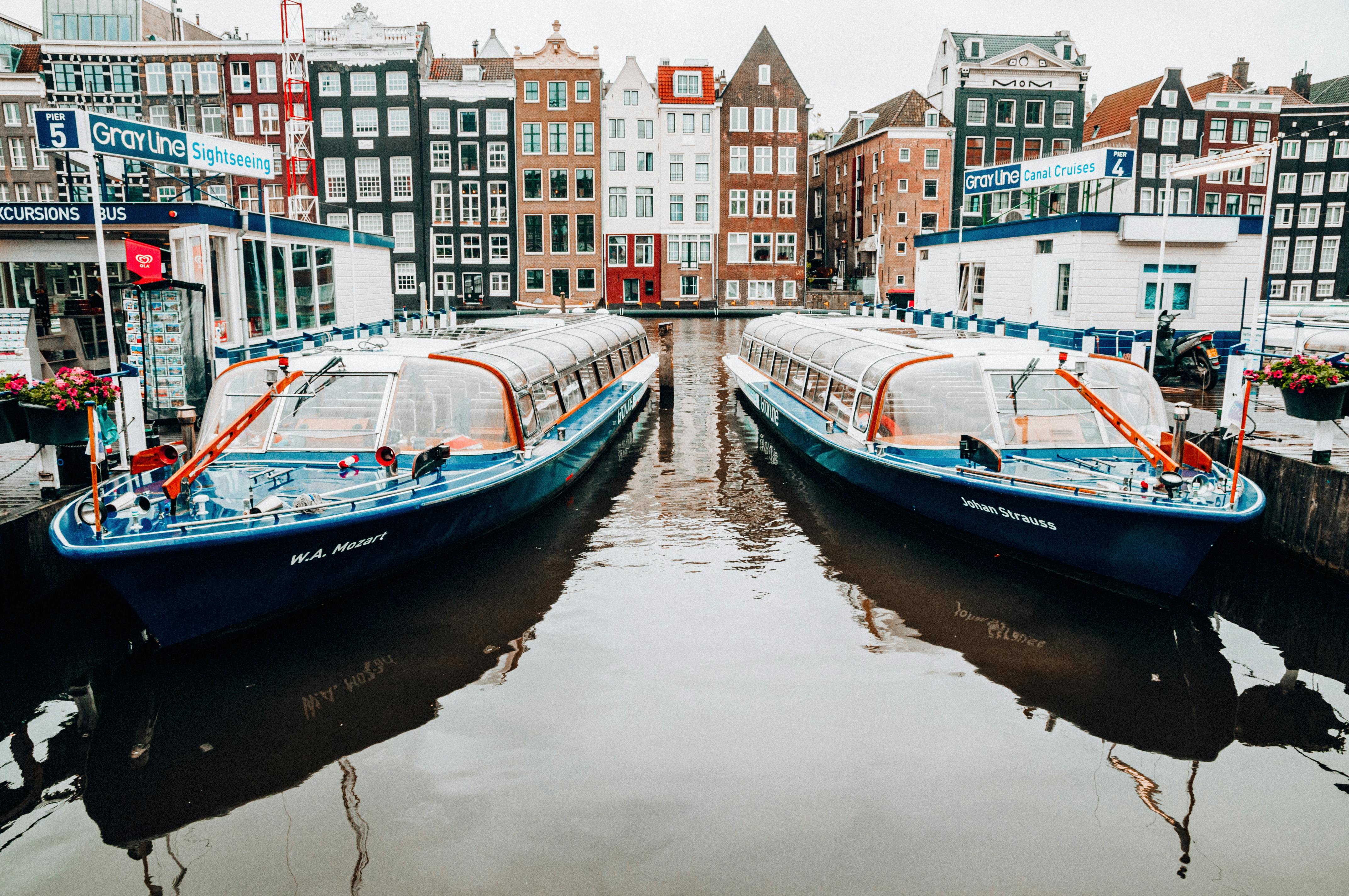 tour boats on a canal in amsterdam
