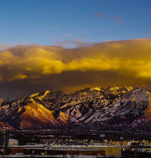 
Mountains under a Cloudy Sky