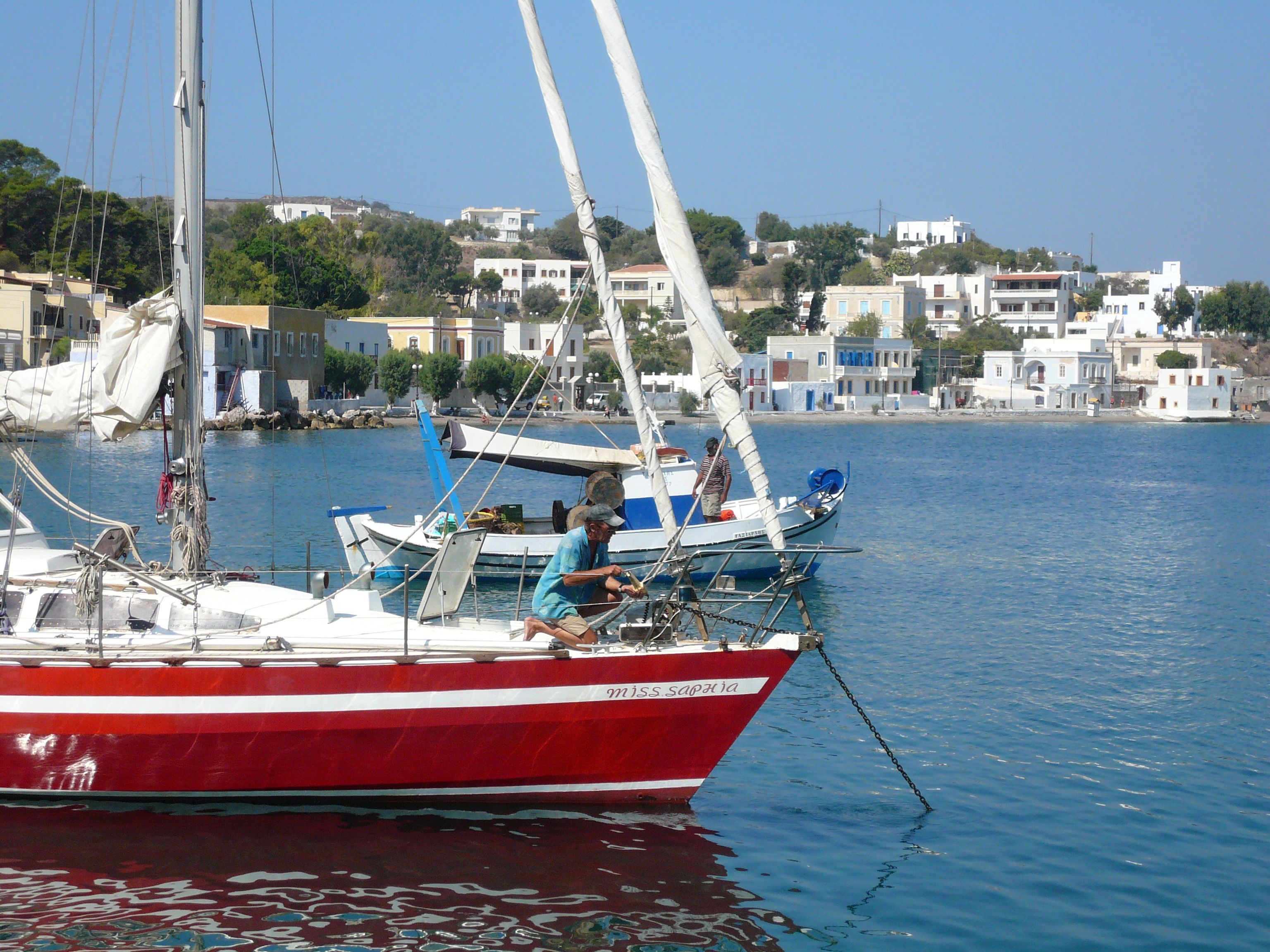 Best Athens Cruise: Agistri, Moni/Metopi, Aegina with Lunch & Drinks Review 2026 - Serene scene of sailboats moored in the picturesque harbor of Leros, Greece with a charming waterfront.