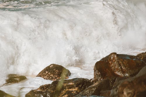 A Beach Waves Crashing on Rocks