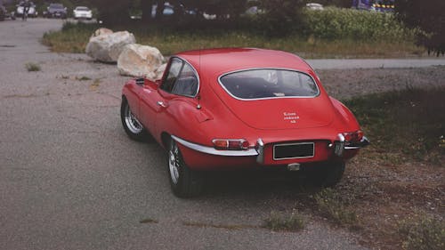 A Red Classic Car Parked on the Street