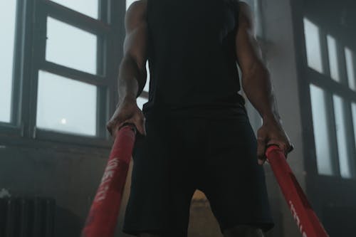 A Person Holding Battle Ropes