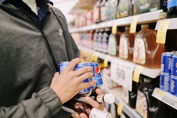 A Person Buying From A Grocery