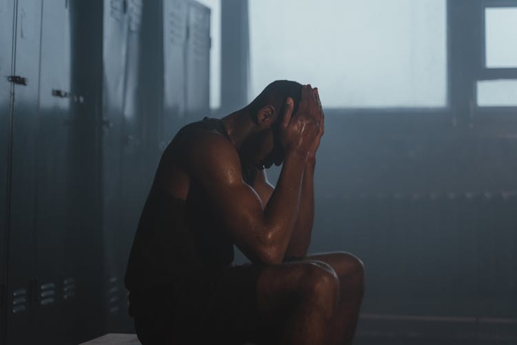 Sweaty Man With His Hand On His Head