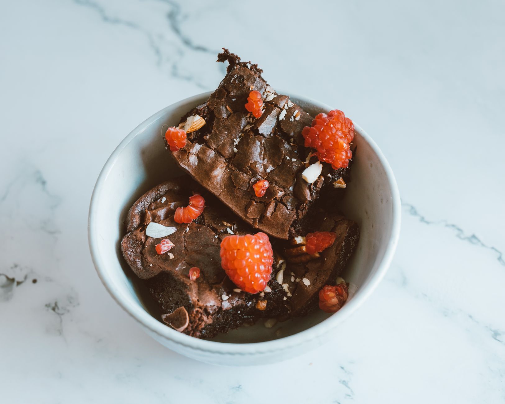 Mexican Rhubarb Chocolate Chunk Brownies freshly baked in a glass pan