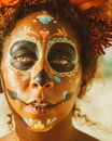 Woman With White and Brown Face Paint