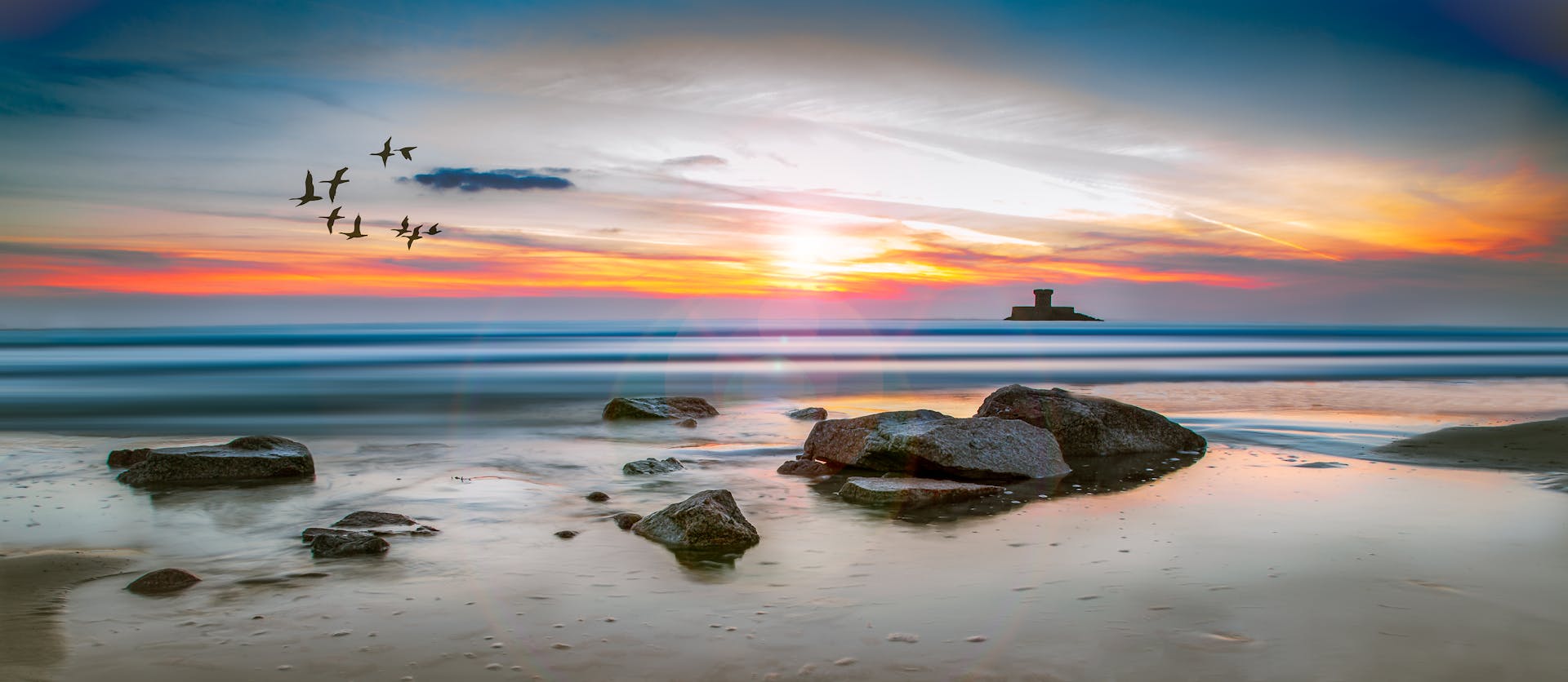 Sea Rocks Surrounded by Body of Water High-saturated Photography