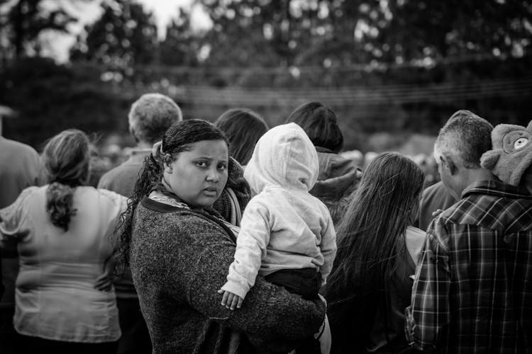 A Woman Holding Her Child