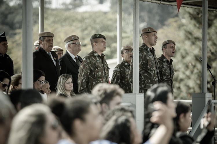 Soldiers And Military Veterans Singing Hymn At Parade