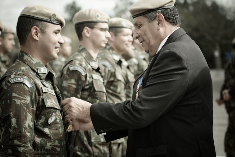 General Awarding Soldiers With Medals 