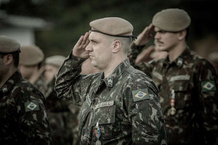 Soldiers Standing And Saluting