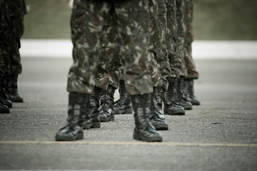 Legs of Soldiers Standing Astride