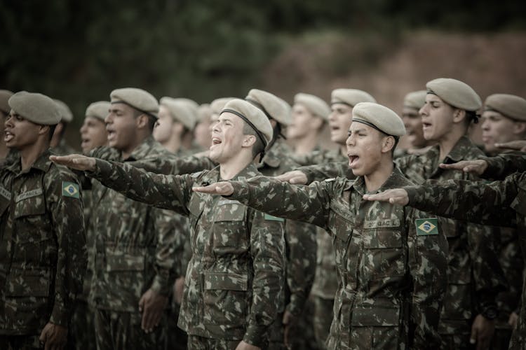 Soldiers Standing In A Row And Saluting