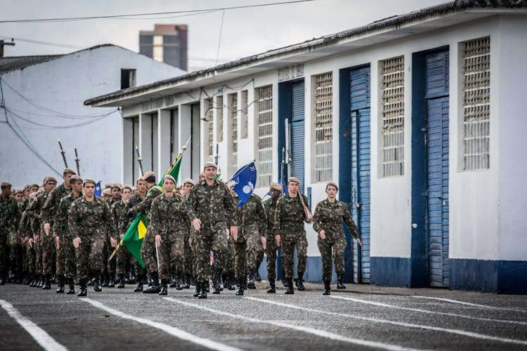 Military Men Marching On A Street