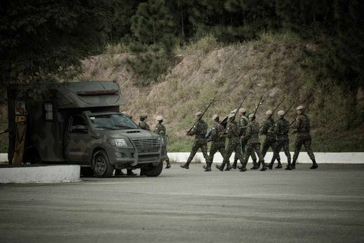 Small Group Of Soldiers Marching In Formation