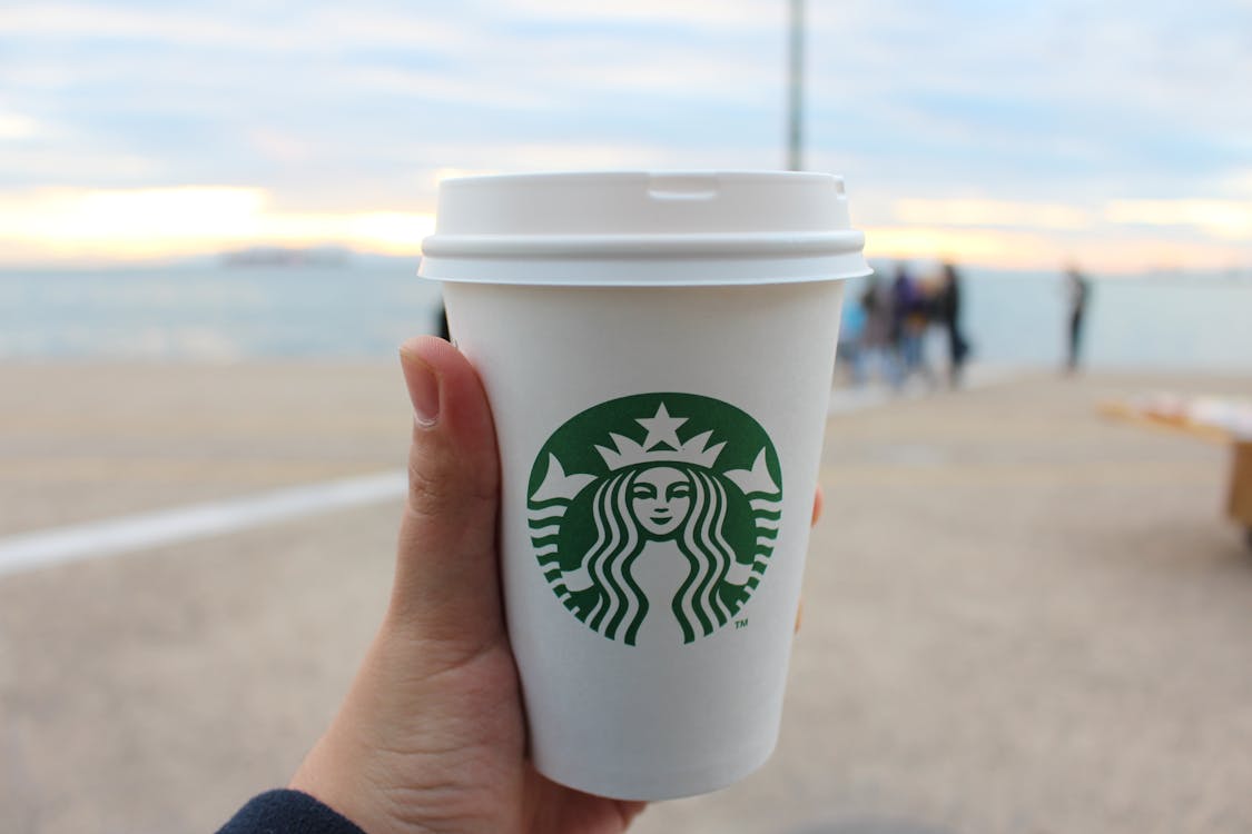 Free Person Holding Star Buck Plastic Cup Stock Photo