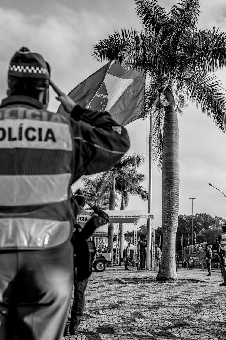 Back Of A Police Officer Saluting