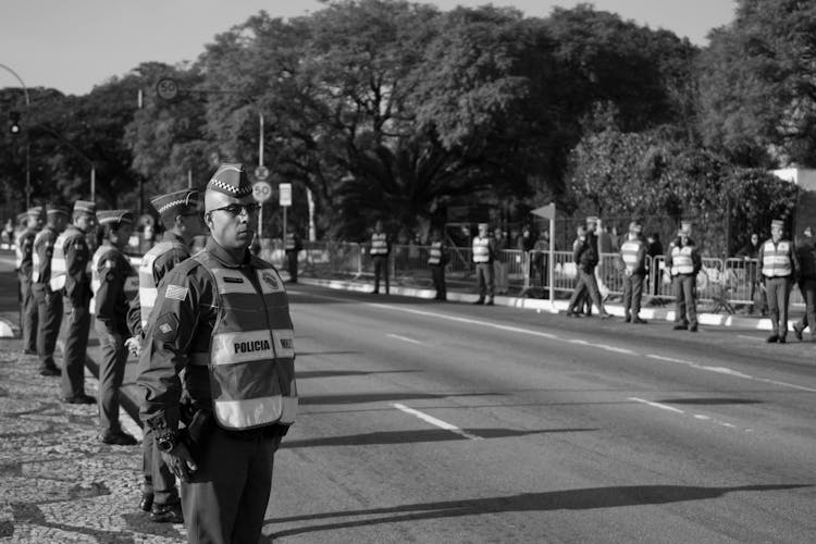 Police Officers Standing On Road