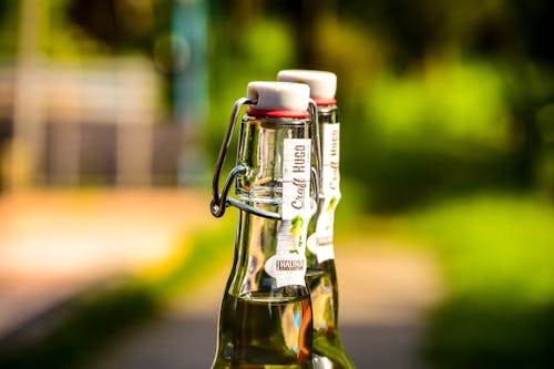 Selective Focus Photography of Two Clear Air Tight Bottles