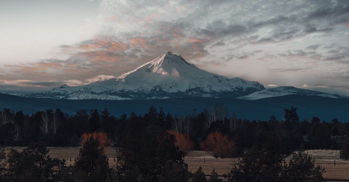 Capture the serene beauty of Mount Hood during a stunning sunset in Oregon.