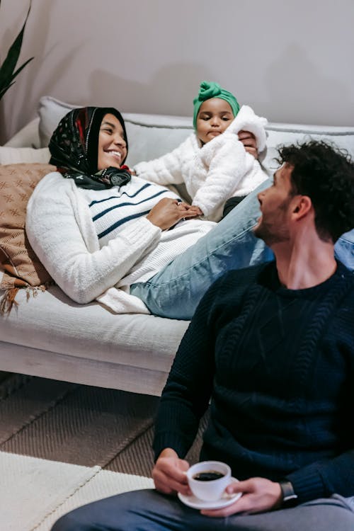 Cheerful multiethnic family enjoying parenthood time