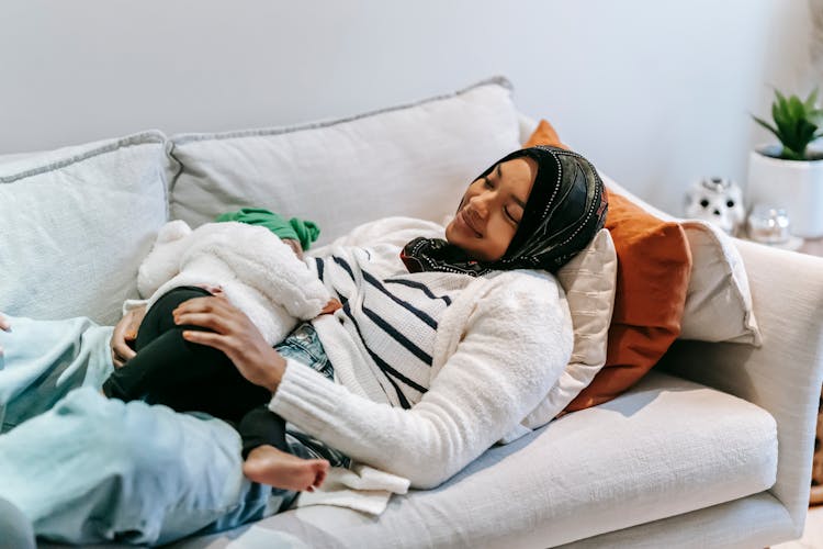 Positive Black Woman Breastfeeding Little Child