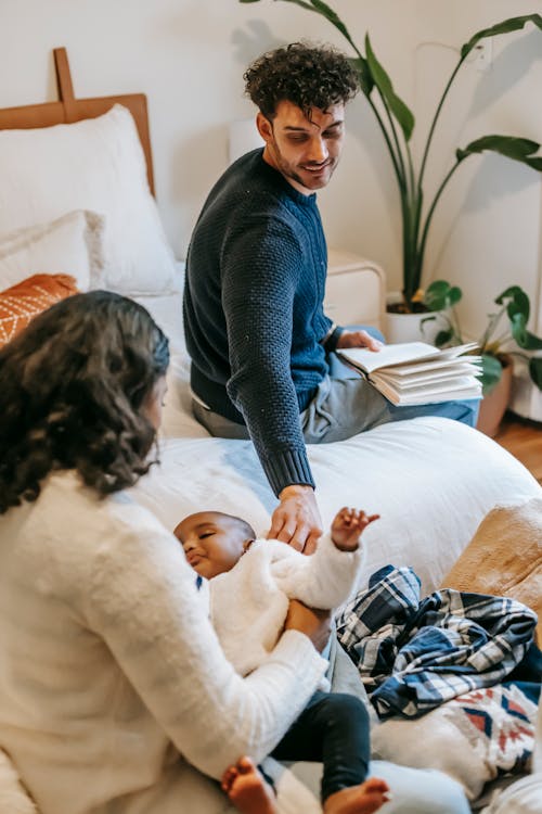 Multiethnic family with infant in bedroom