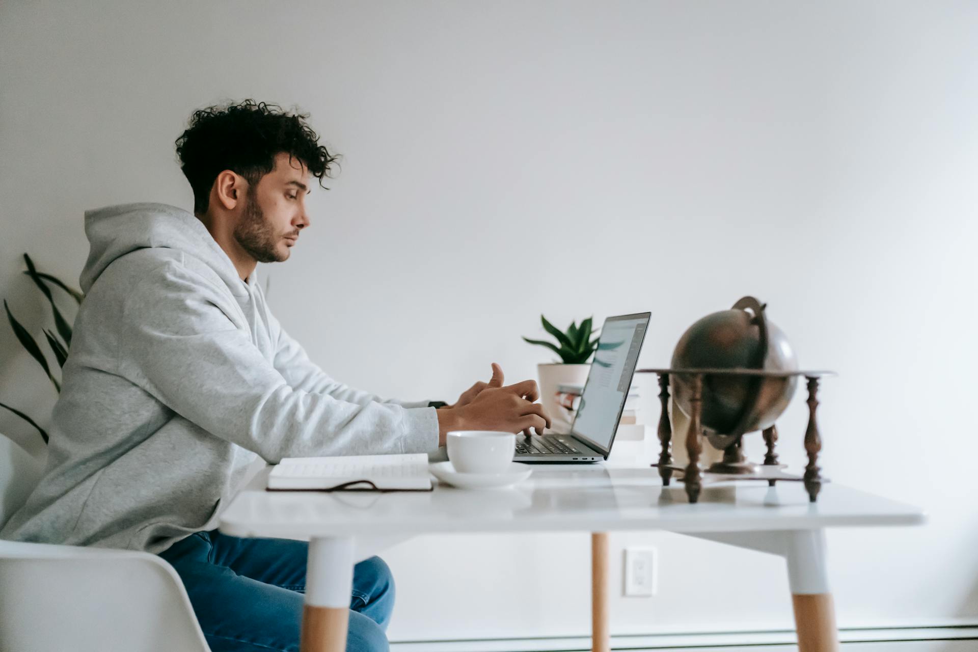 Remote employee working on laptop at home