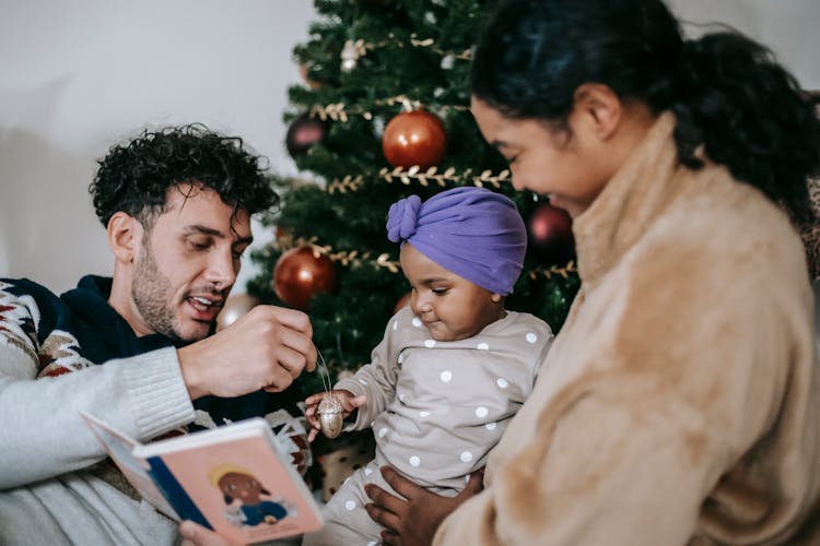 Diverse Members Of Friendly Family Celebrating Christmas