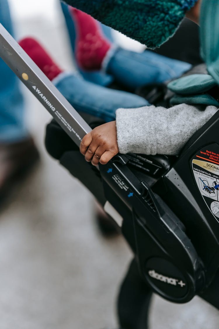 Ethnic Baby In Stroller In Daytime