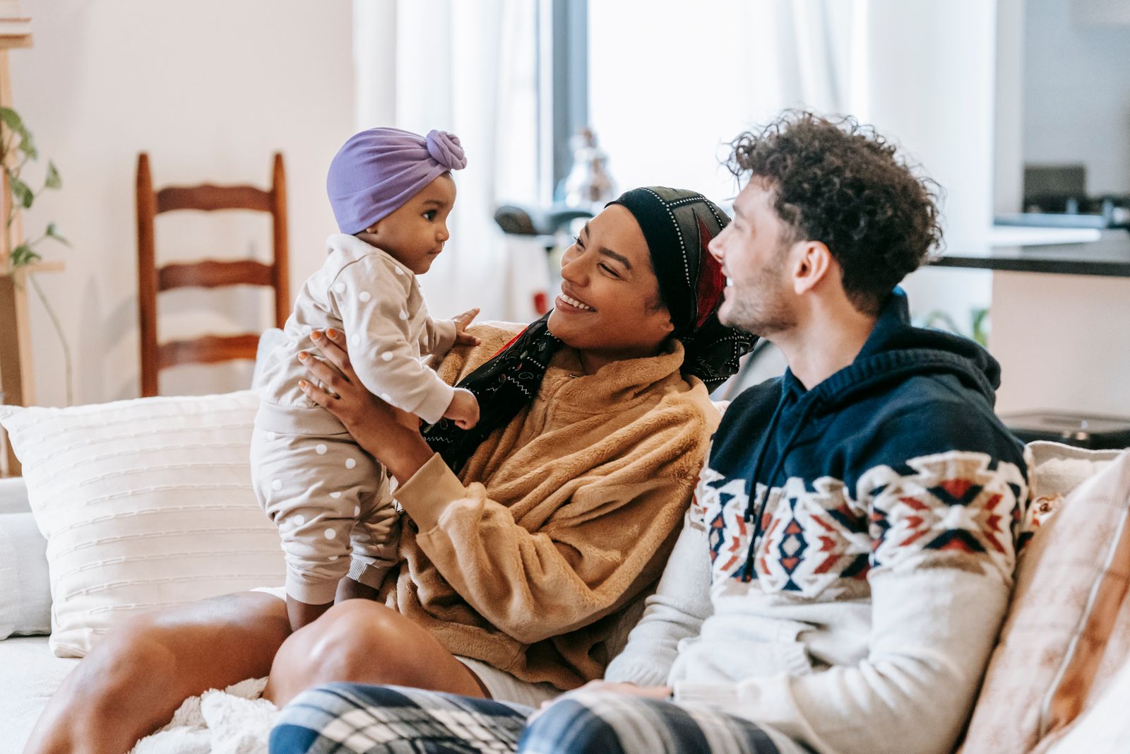 Parents spending time at home with their baby