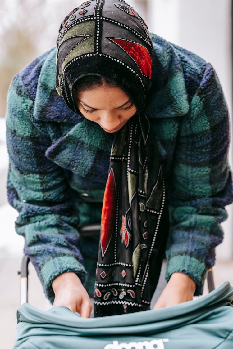 Serious Black Mother Near Baby Stroller