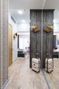 Suitcase in stylish corridor near mirror