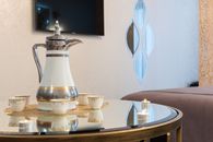 Table with coffee pot and mugs