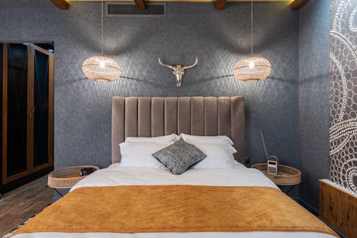 Modern bedroom interior with decorative deer horns on wall