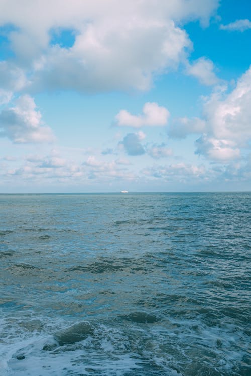 Wavy sea under clear blue sky