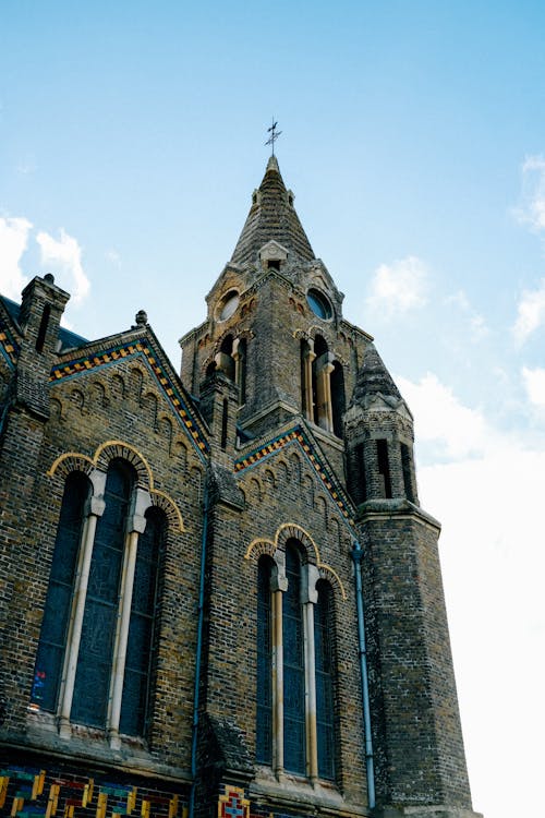 Facade of medieval brick church on sunny day