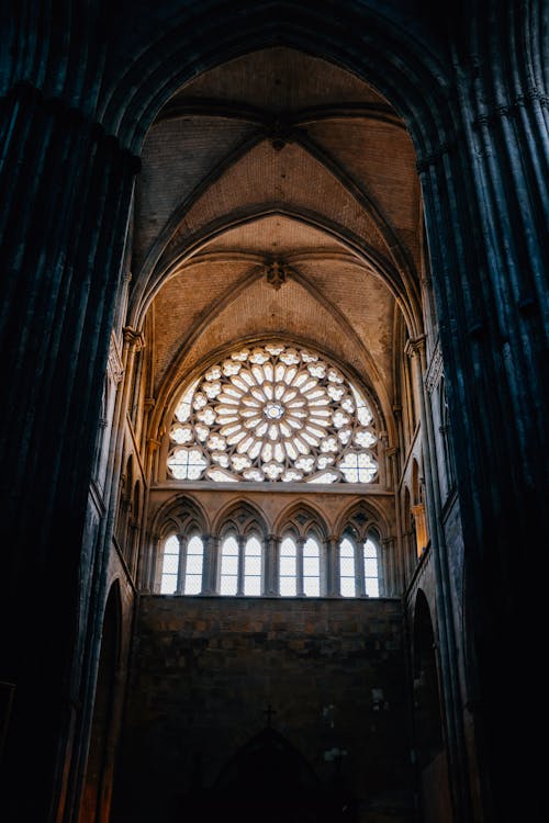 Interior of ancient Gothic style church with arched windows