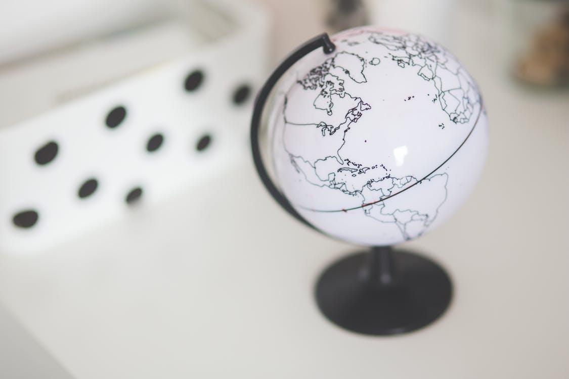 Free White globe on a desk Stock Photo