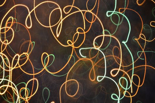 Creative abstract art featuring dynamic light trails captured in long exposure photography.